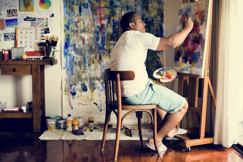 Black artist man doing artwork
