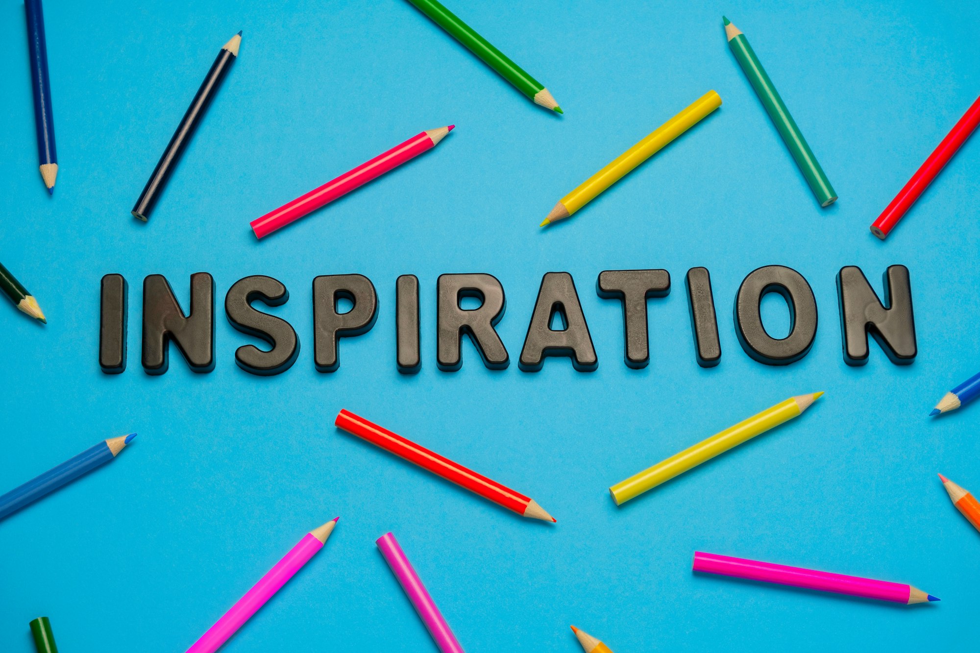 The word Inspiration with pencils around it.